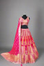Radiate elegance in this vibrant pink and orange lehenga.
