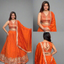Vibrant orange lehenga features detailed thread and foil embroidery.