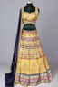 Shine bright in this mustard and navy lehenga