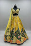 Vibrant yellow lehenga with intricate hand-embroidered detailing