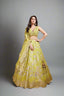 Yellow lime color lehenga with intricate threadwork
