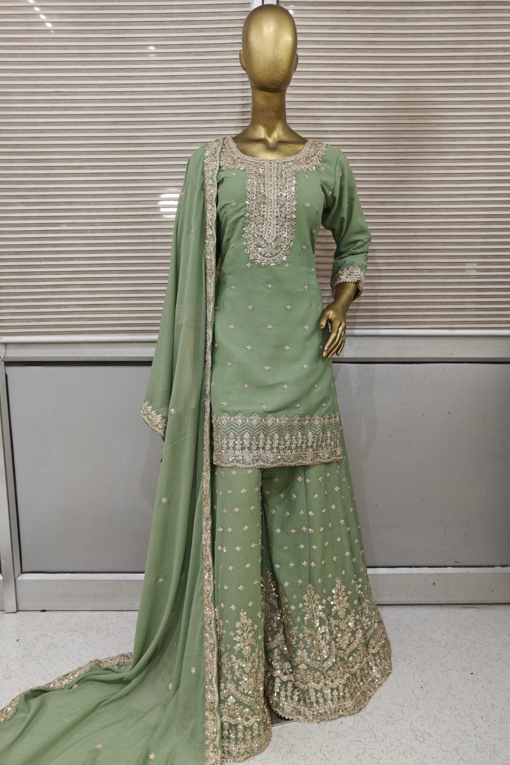 Green color sharara set with handcrafted top and soft net dupatta