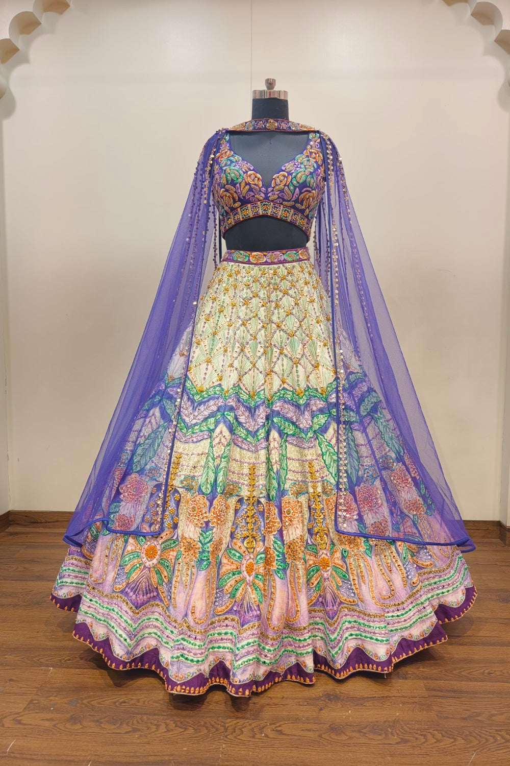 Luxurious Multi-Toned Lehenga with Cream Base and Elegant Purple Net Dupatta - Designer Ethnic Masterpiece