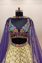Luxurious Multi-Toned Lehenga with Cream Base and Elegant Purple Net Dupatta - Designer Ethnic Masterpiece