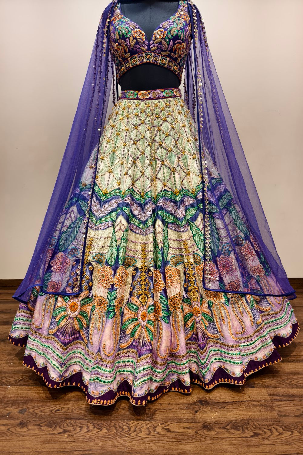 Luxurious Multi-Toned Lehenga with Cream Base and Elegant Purple Net Dupatta - Designer Ethnic Masterpiece