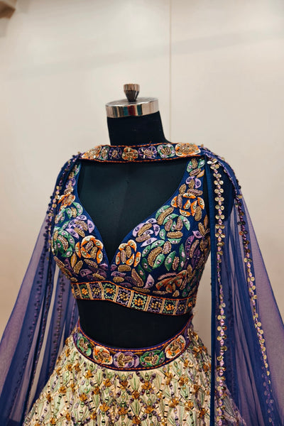 Luxurious Multi-Toned Lehenga with Cream Base and Elegant Purple Net Dupatta - Designer Ethnic Masterpiece