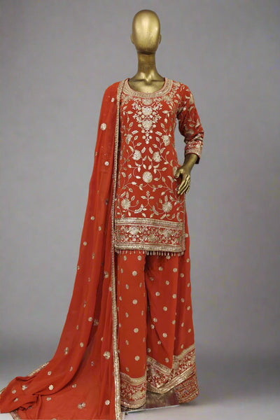 Stunning purple embroidered salwar suit with golden detailing
