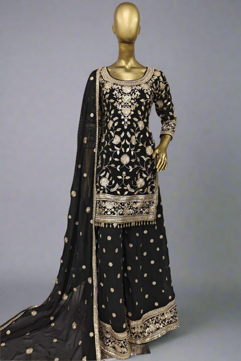 Stunning purple embroidered salwar suit with golden detailing