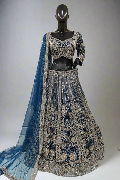Elegant rust-orange bridal lehenga with intricate golden embroidery