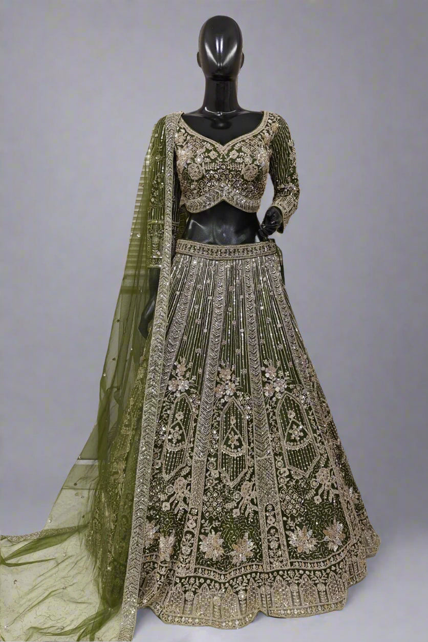 Elegant rust-orange bridal lehenga with intricate golden embroidery