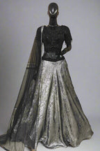 Glamorous black and silver lehenga with a shimmering skirt and sequined blouse