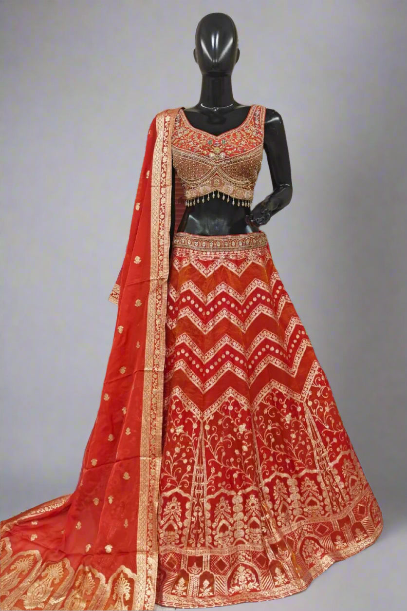 Traditional red lehenga with rich gold embroidery
