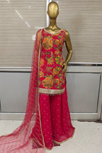 Stunning bright pink Punjabi suit featuring heavy floral embroidery