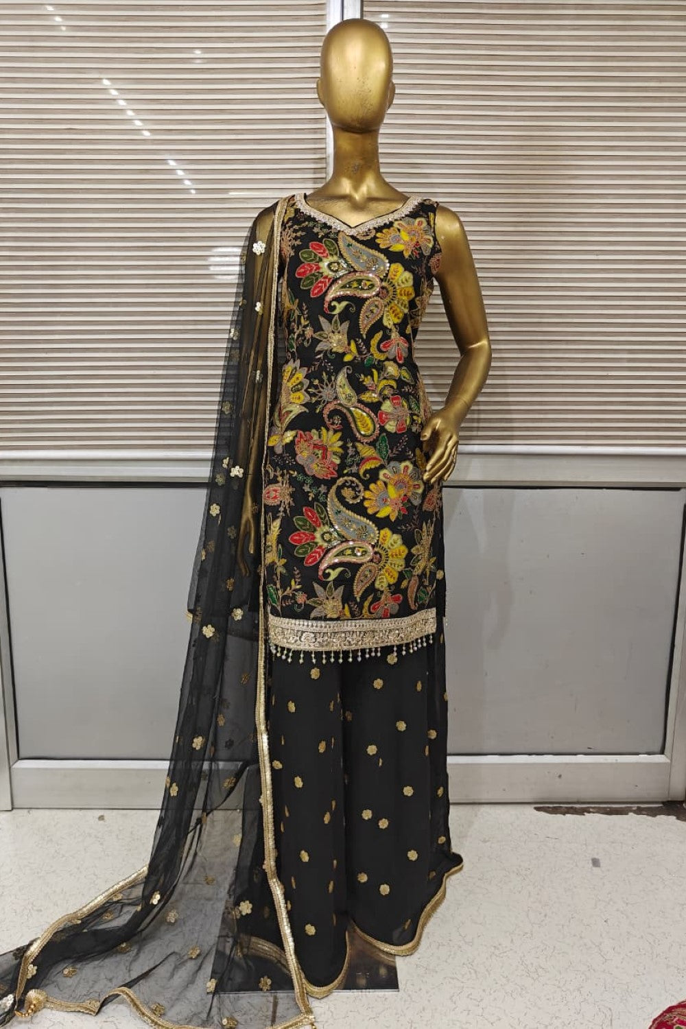 Stunning bright pink Punjabi suit featuring heavy floral embroidery