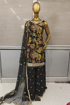 Stunning bright pink Punjabi suit featuring heavy floral embroidery