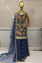 Stunning bright pink Punjabi suit featuring heavy floral embroidery