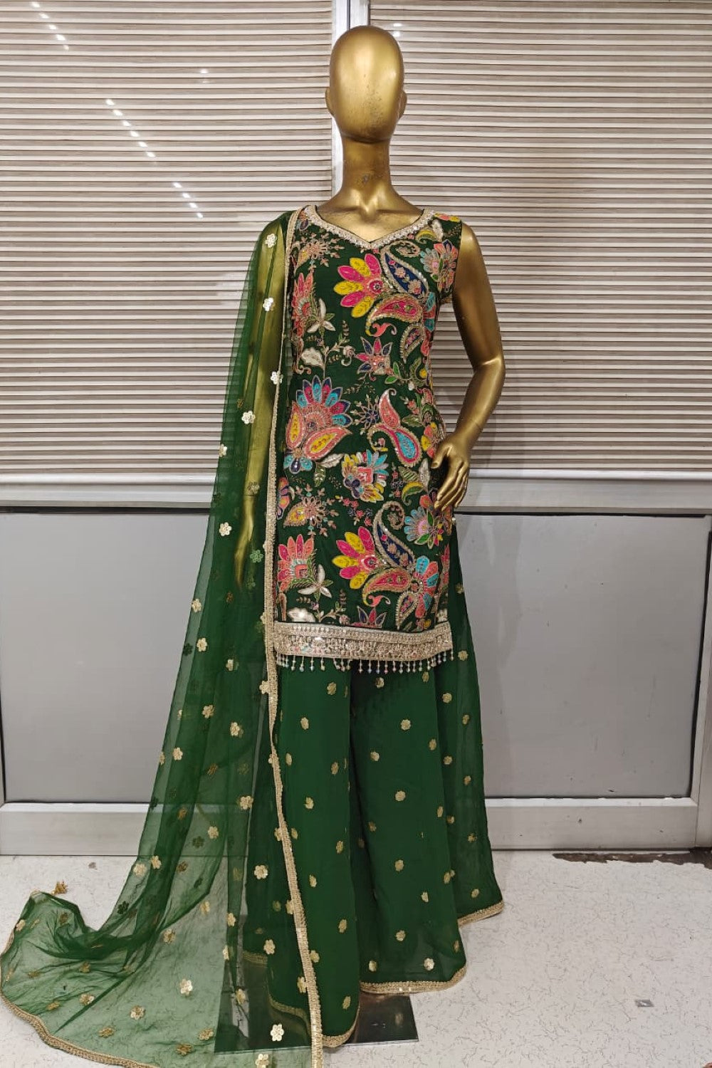 Stunning bright pink Punjabi suit featuring heavy floral embroidery