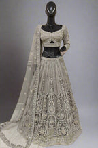 Sparkly blue lehenga with Sequins and moti work