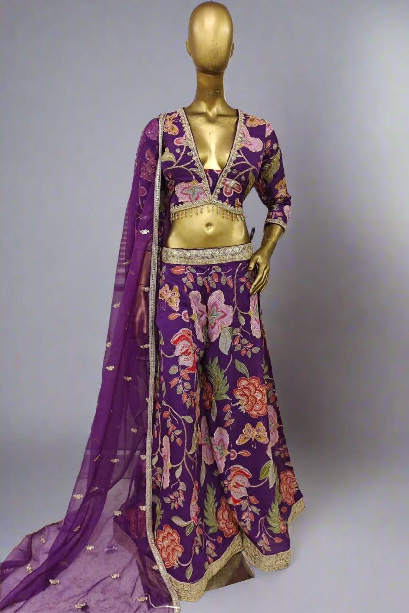 Bright pink embroidered plazzo outfit with bold floral motifs