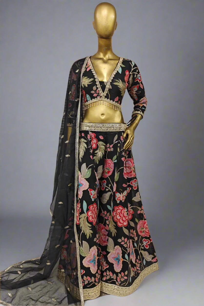 Bright pink embroidered plazzo outfit with bold floral motifs