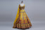Sunshine yellow mirror-work lehenga with intricate embroidery.