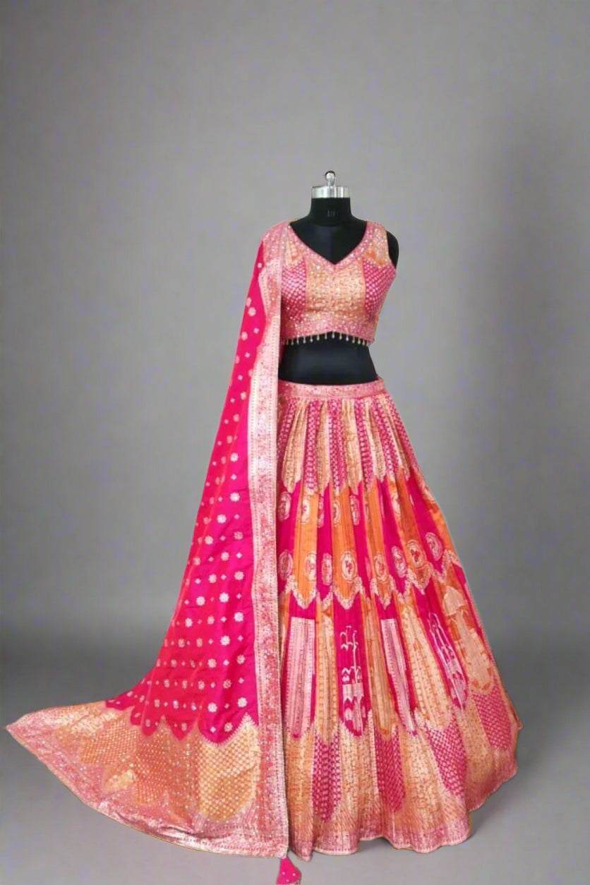 Radiate elegance in this vibrant pink and orange lehenga.
