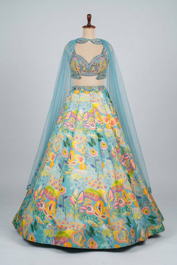 Stunning turquoise lehenga featuring vibrant floral prints
