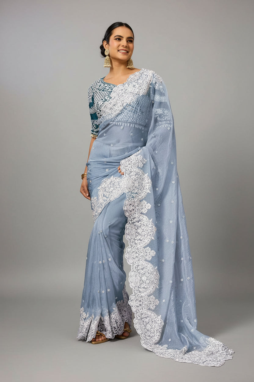 Powder blue saree adorned with exquisite white embroidery