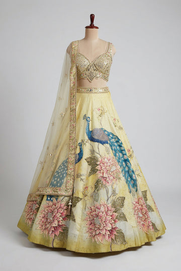 Elegant pastel yellow lehenga featuring stunning peacock embroidery