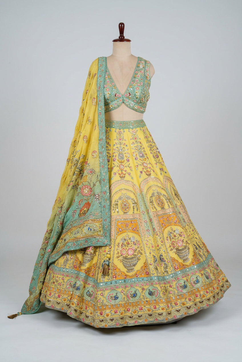Beautiful sunshine-yellow lehenga featuring intricate floral embroidery,