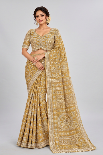 Mustard yellow saree featuring intricate ivory geometric embroidery
