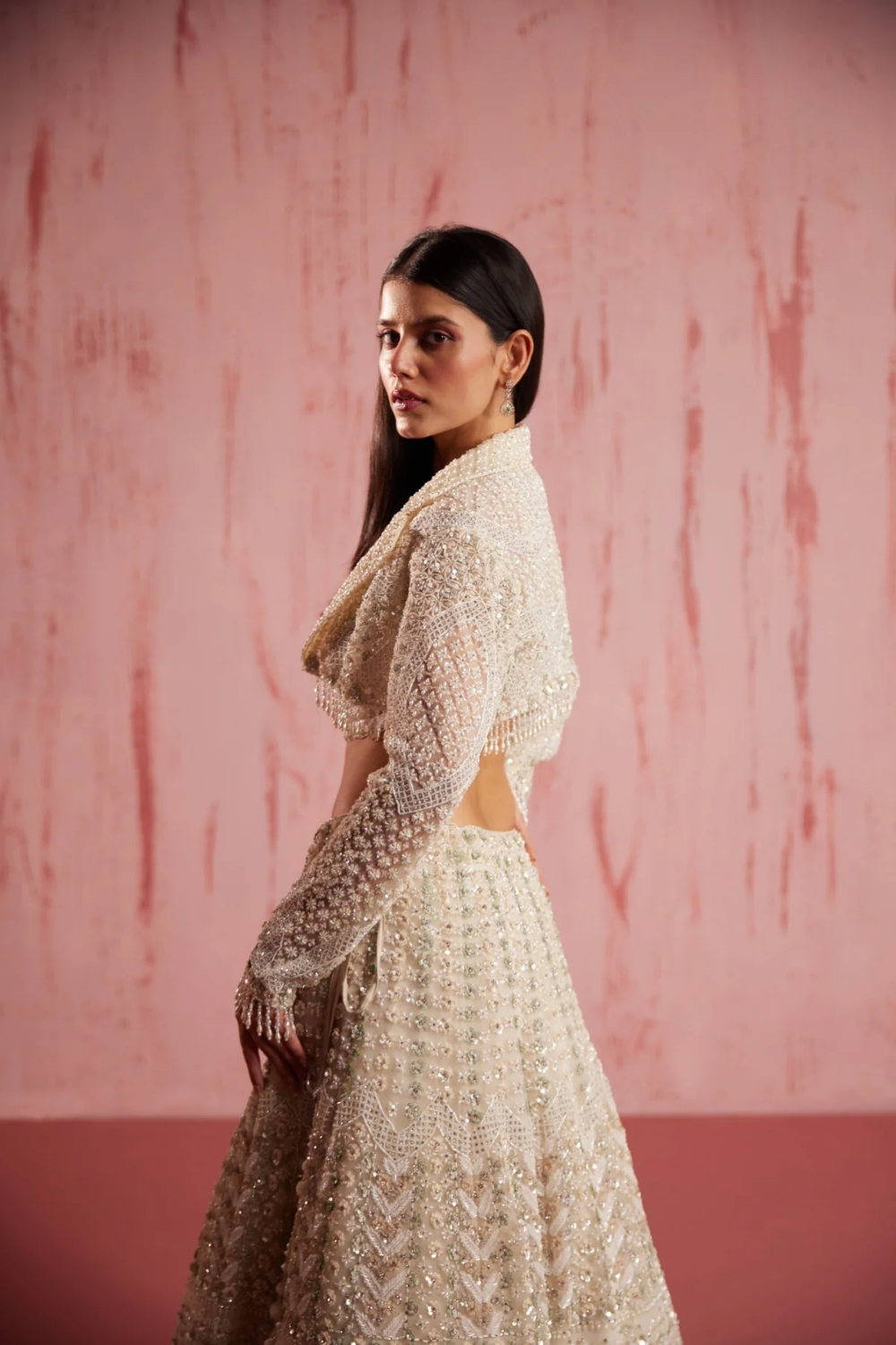 Ivory handmade lehenga with stone and Swarovski work