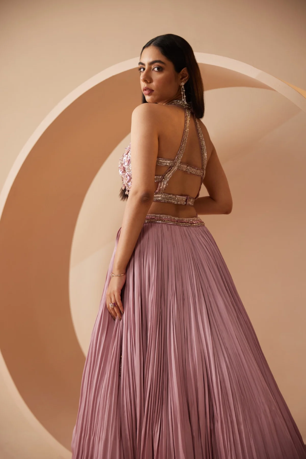 Nude color lehenga embroidered with sequins and cutdana