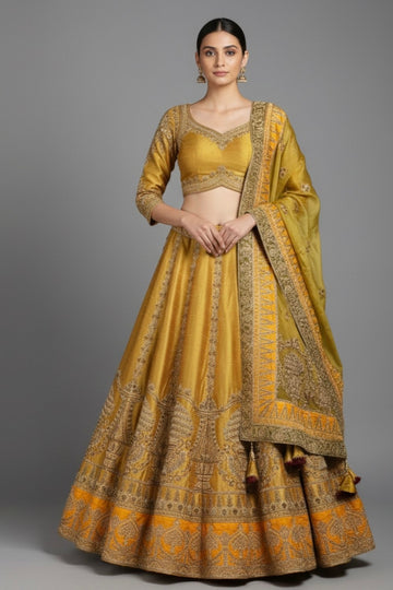 Elegant mustard gold lehenga set with intricate embroidery, perfect for wedding.