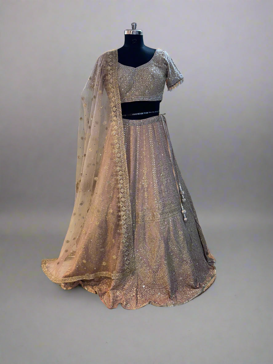 Blush pink net lehenga with heavy sequin embroidery