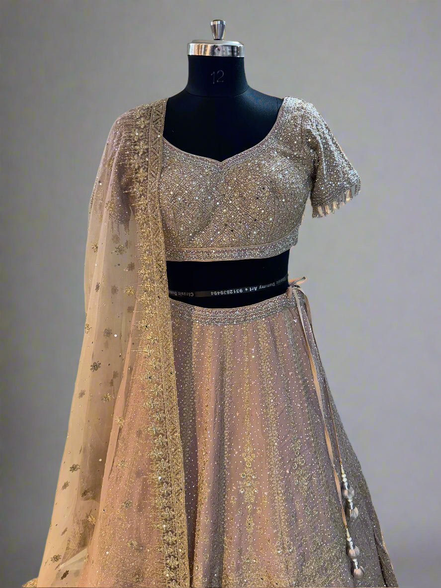 Blush pink net lehenga with heavy sequin embroidery