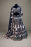 Elegant navy blue net lehenga set with intricate white swan embroidery and floral sequin detailing
