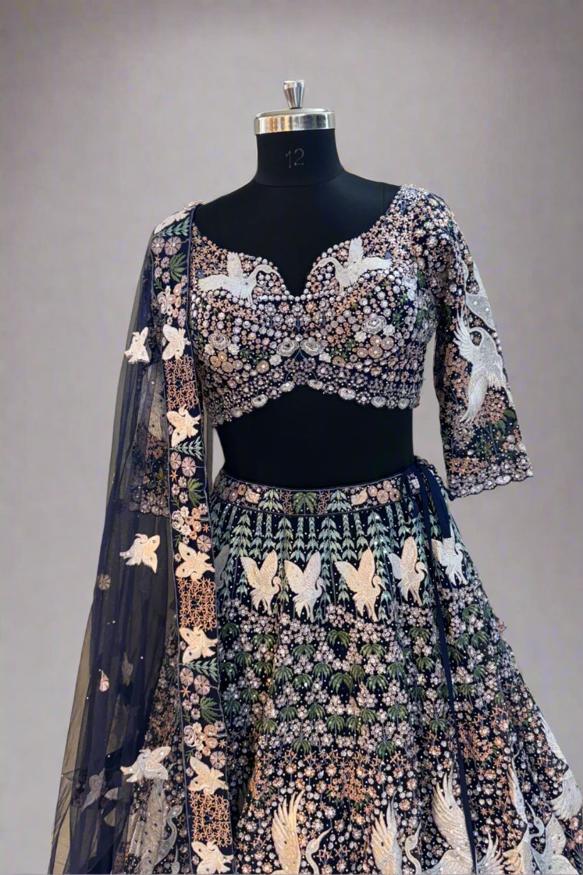 Elegant navy blue net lehenga set with intricate white swan embroidery and floral sequin detailing Secondary image