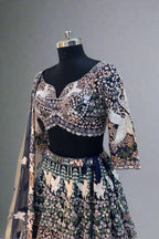Elegant navy blue net lehenga set with intricate white swan embroidery and floral sequin detailing