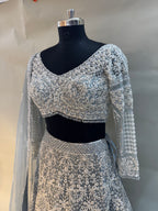 Grace meets glamour in this pastel grey net lehenga