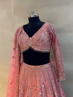 Radiate charm in this vibrant pink lehenga set, crafted in luxurious silk fabric
