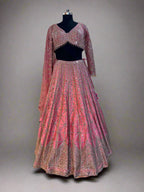Radiate charm in this vibrant pink lehenga set, crafted in luxurious silk fabric