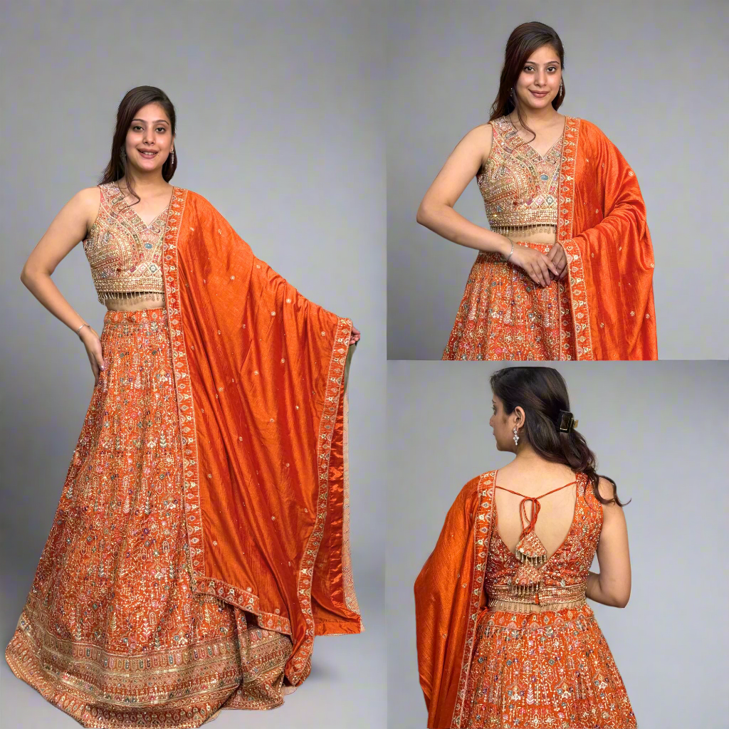 Mirror-embroidered orange lehenga brings festive charm and traditional grace.