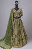 Stunning green lehenga set featuring rich golden embroidery.
