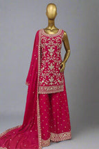 Elegant magenta ethnic ensemble with intricate golden embroidery