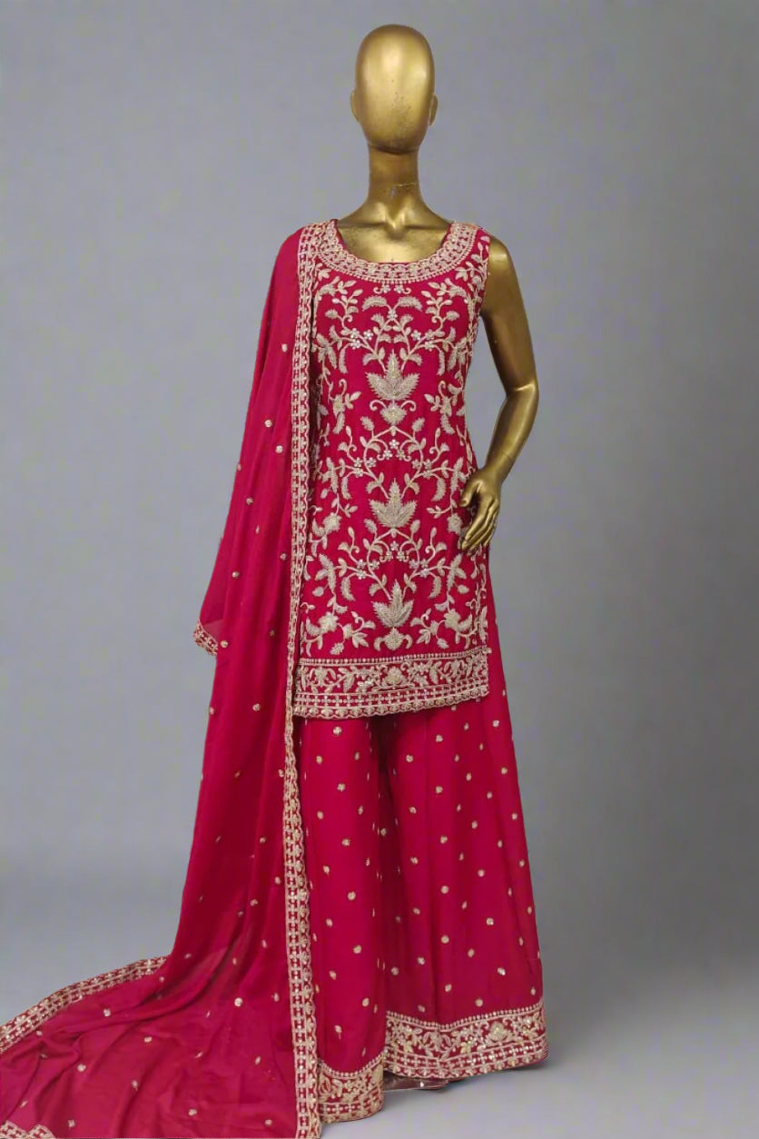 Elegant magenta ethnic ensemble with intricate golden embroidery