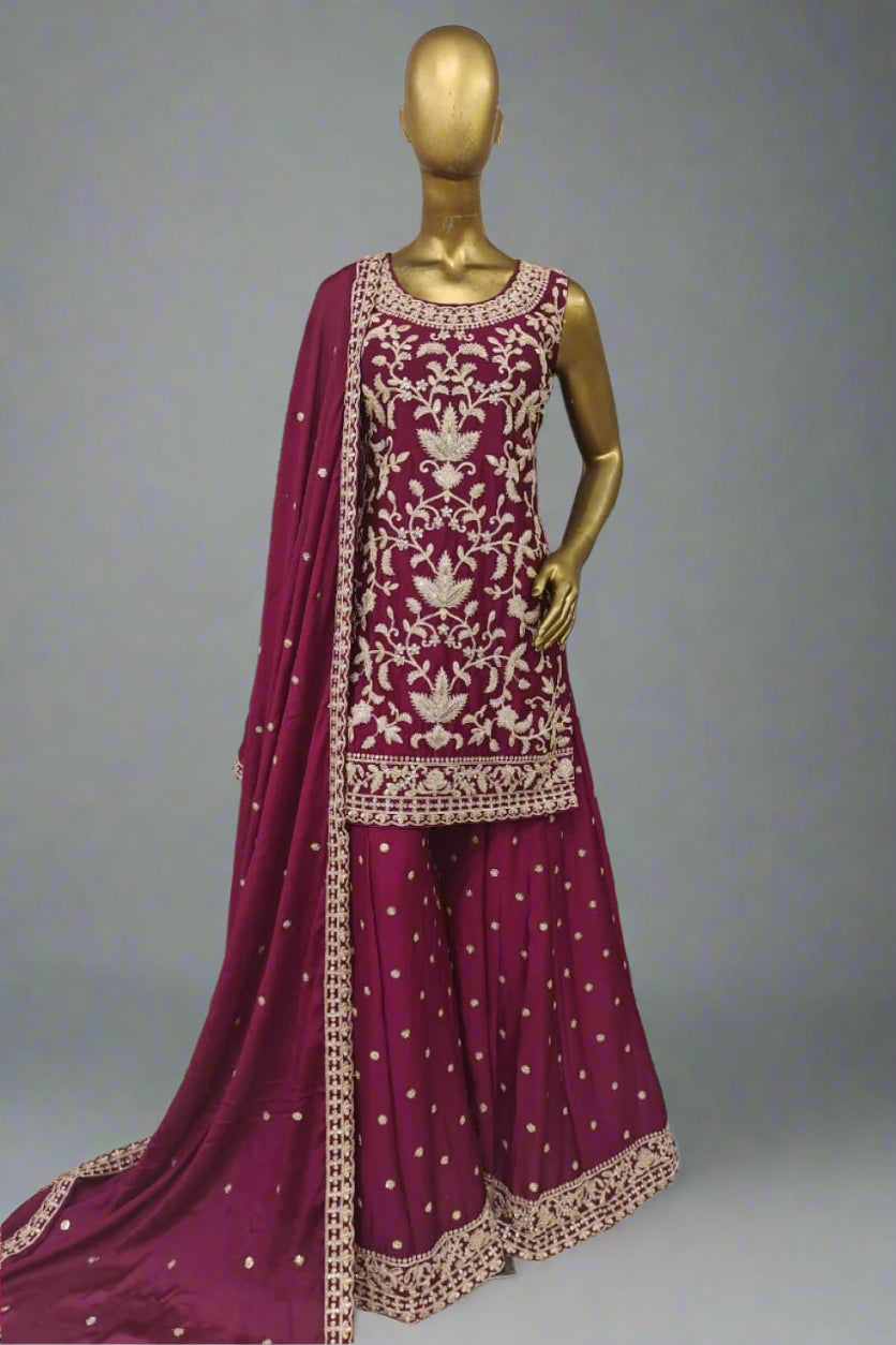 Elegant magenta ethnic ensemble with intricate golden embroidery