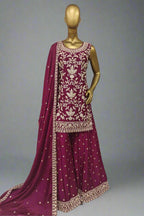 Elegant magenta ethnic ensemble with intricate golden embroidery