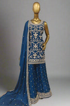 Elegant magenta ethnic ensemble with intricate golden embroidery