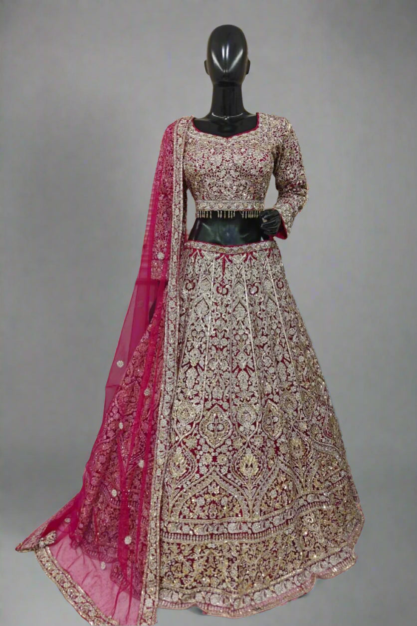 Graceful maroon and gold lehenga with intricate embroidery